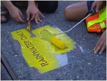 Yellow fish road progam painting yellow fish near cathbasins