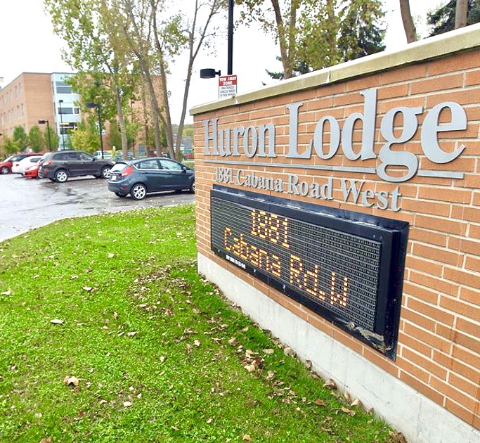 Sign outside Huron Lodge reading 1881 Cabana Road West