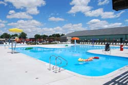 Riverside pool under clear skies