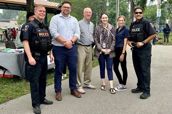 SSNAPP and Downtown Windsor Community Collaborative representatives gathered outside at a potluck event at Bruce Park