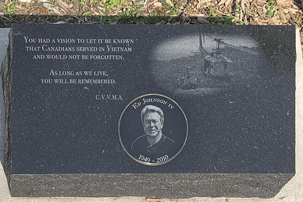 Detail of a memorial list etched into granite.