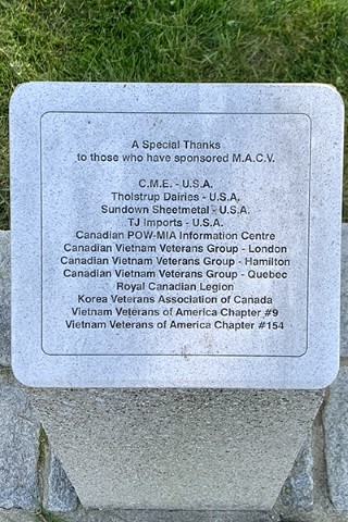 Detail of a memorial list etched into granite.