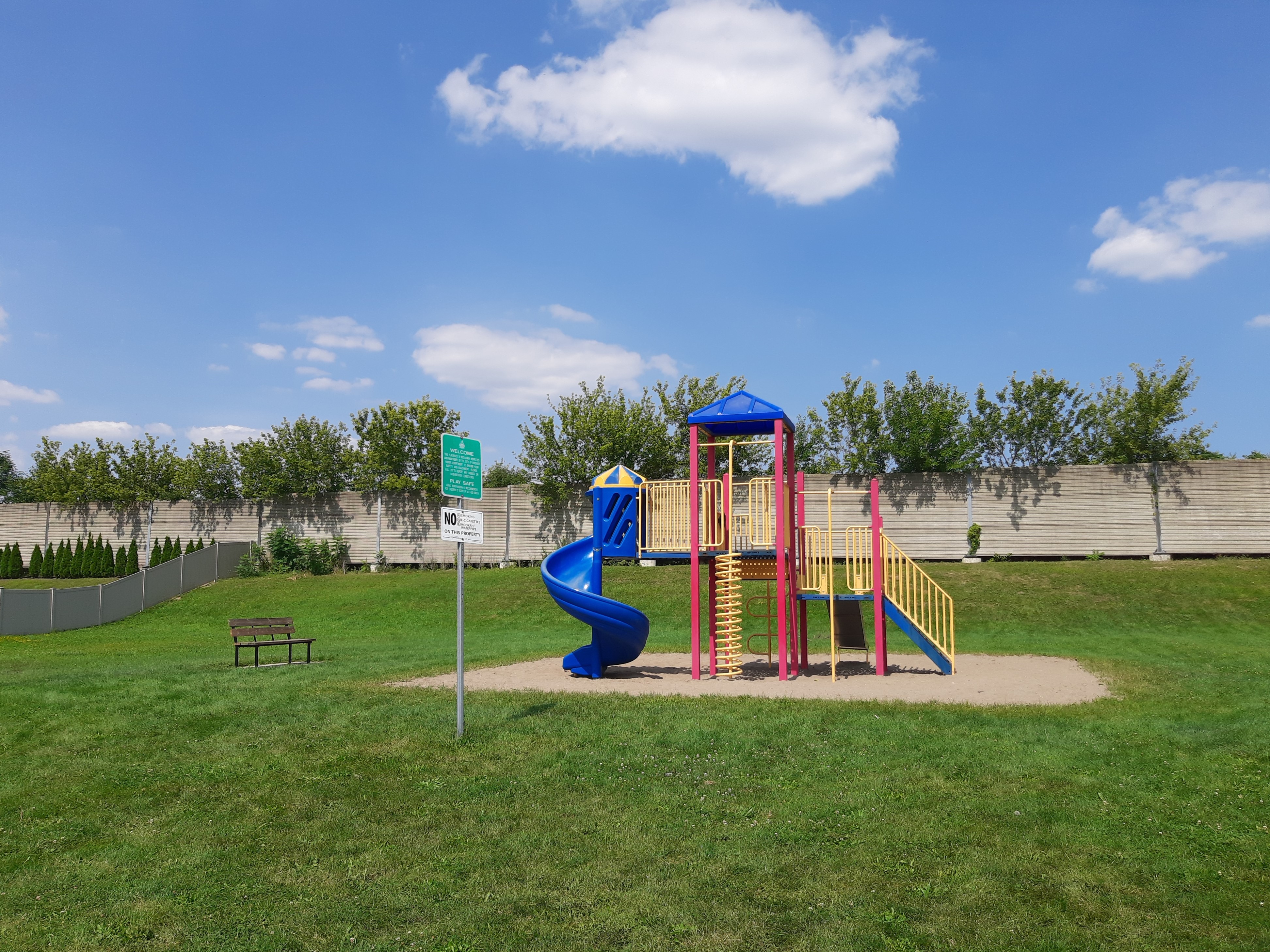 Play unit and bench against blue sky
