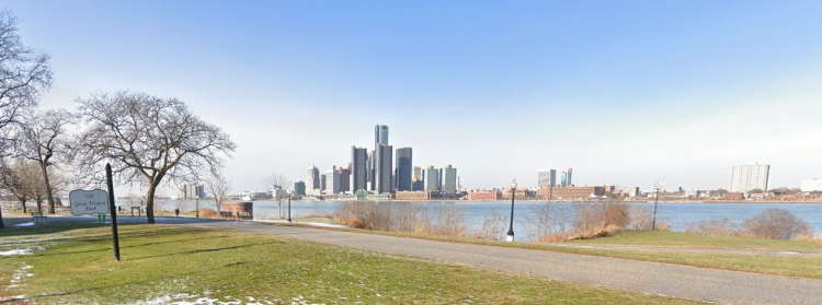 Pathway along the Windsor riverfront with Detroit skyline in the background