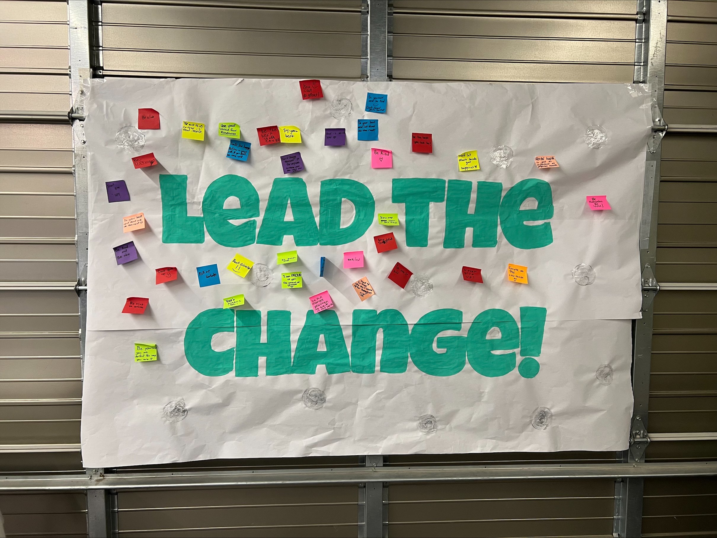 WERCSWB Plan Symposium Lead the Change Mural A mural that says Lead the Change!