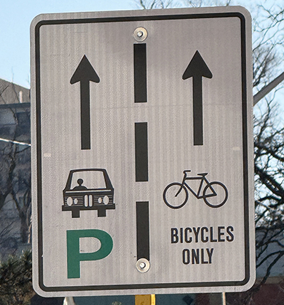 Bicycle Lane Road Sign Road sign indicating cars and parking on the left, bicycles only on the right